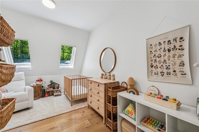 3019 Oak Ridge Ln, Saltlick Twp, PA 15622 - bedroom with wood finished floors and a crib