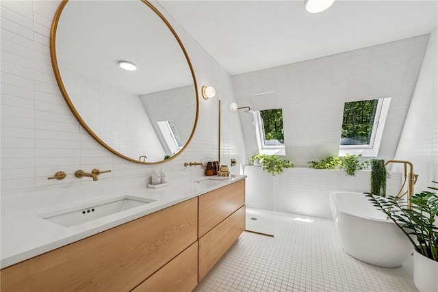3019 Oak Ridge Ln, Saltlick Twp, PA 15622 - bathroom featuring tile walls, double vanity, a freestanding bath, tile patterned floors, and a walk in shower