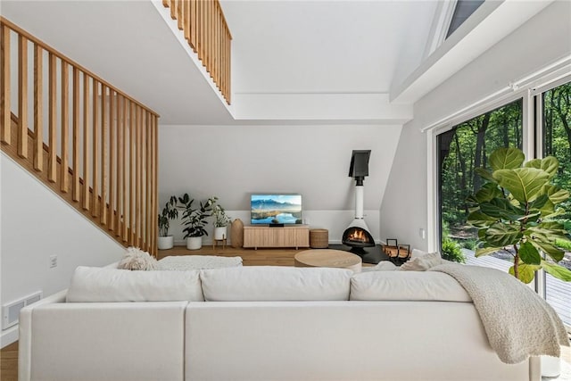 3019 Oak Ridge Ln, Saltlick Twp, PA 15622 - living area with wood finished floors, plenty of natural light, and a towering ceiling