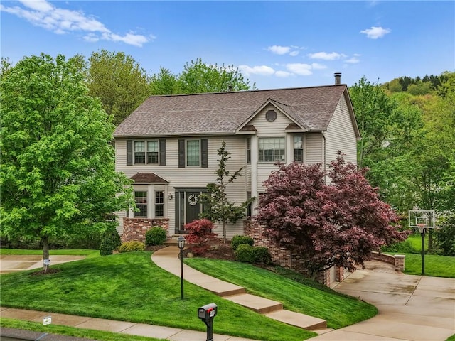 330 Warrick Dr, Seven Fields Boro, PA 16046 - view of front facade featuring a front lawn, roof with shingles, and driveway