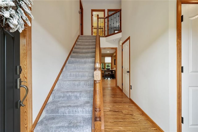 330 Warrick Dr, Seven Fields Boro, PA 16046 - staircase featuring wood finished floors and a high ceiling