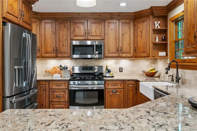 330 Warrick Dr, Seven Fields Boro, PA 16046 - kitchen featuring stainless steel appliances and brown cabinets