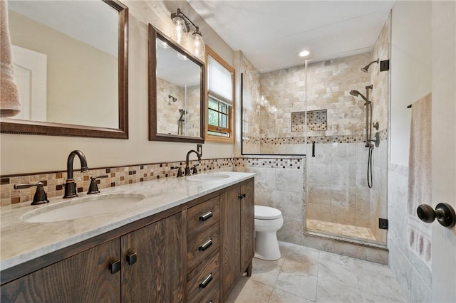 330 Warrick Dr, Seven Fields Boro, PA 16046 - full bath featuring a stall shower, double vanity, tile walls, and recessed lighting