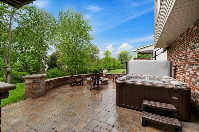 330 Warrick Dr, Seven Fields Boro, PA 16046 - view of patio with a hot tub, a fire pit, and view of scattered trees
