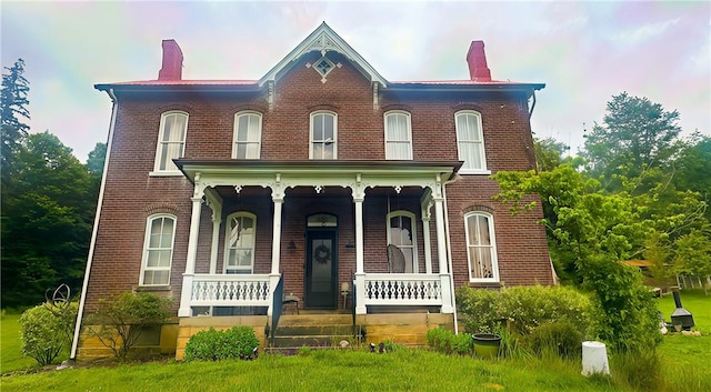 389 Rices Landing Rd, Luzerne Twp, PA 15433 - view of front facade featuring a chimney, a porch, and brick siding