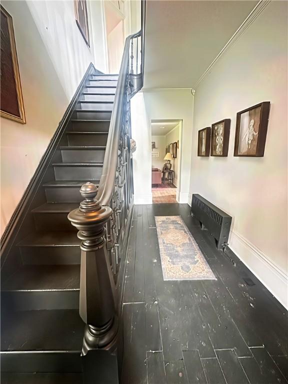 389 Rices Landing Rd, Luzerne Twp, PA 15433 - stairs with wood finished floors, ornamental molding, and heating unit
