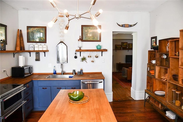 389 Rices Landing Rd, Luzerne Twp, PA 15433 - kitchen with wood counters, open shelves, blue cabinets, and double oven range