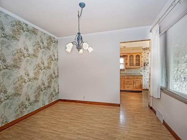 127 Pleasant Hills Blvd, Pleasant Hills, PA 15236 - empty room with light wood-style flooring, a chandelier, ornamental molding, and wallpapered walls