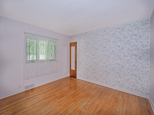 127 Pleasant Hills Blvd, Pleasant Hills, PA 15236 - spare room featuring light wood-style floors and wallpapered walls