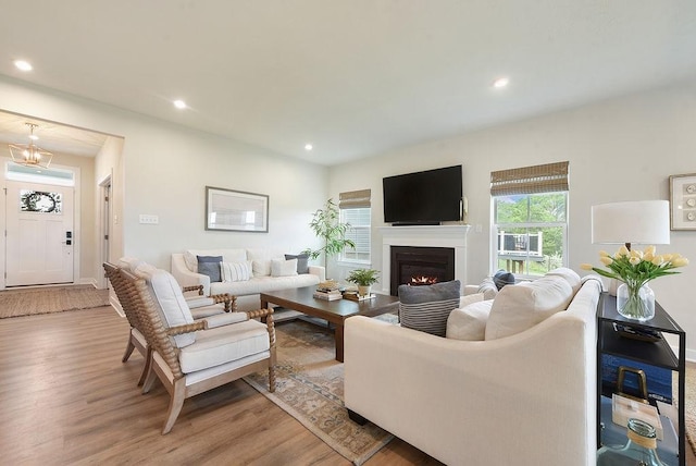 622 Burberry Blvd, Lehigh Twp, PA 16063 - living room featuring wood finished floors, recessed lighting, and a warm lit fireplace