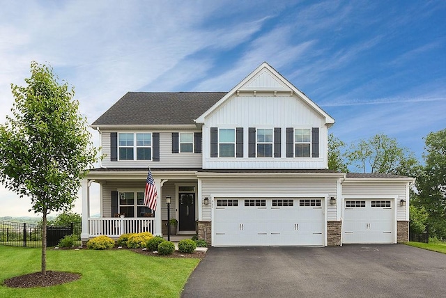 622 Burberry Blvd, Lehigh Twp, PA 16063 - craftsman-style house with board and batten siding, a porch, asphalt driveway, stone siding, and an attached garage