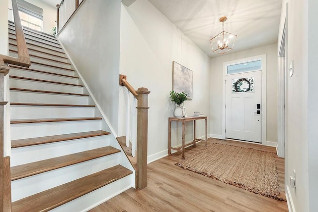 622 Burberry Blvd, Lehigh Twp, PA 16063 - foyer entrance with stairs, light wood-type flooring, and a chandelier