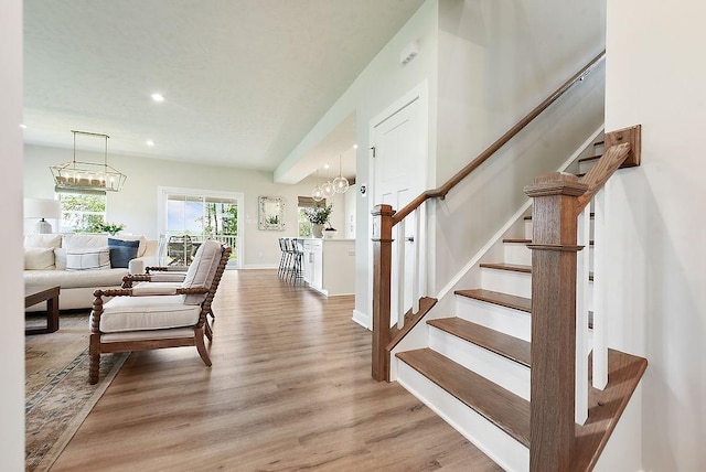622 Burberry Blvd, Lehigh Twp, PA 16063 - living area featuring light wood finished floors, stairs, recessed lighting, and a chandelier