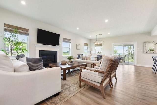 622 Burberry Blvd, Lehigh Twp, PA 16063 - living room featuring light wood-type flooring, recessed lighting, and a glass covered fireplace