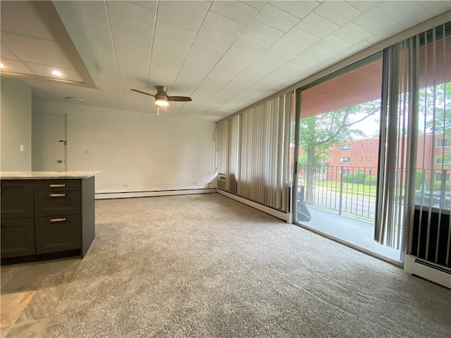 446 Hoodridge Dr Unit 210, Castle Shannon, PA 15234 - unfurnished living room featuring healthy amount of natural light, ceiling fan, a baseboard radiator, and light carpet
