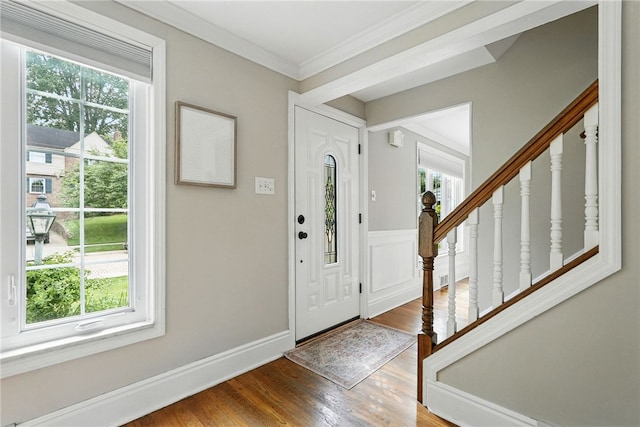 717 Kewanna Ave, Mt Lebanon, PA 15234 - foyer with plenty of natural light, wood finished floors, stairs, and crown molding