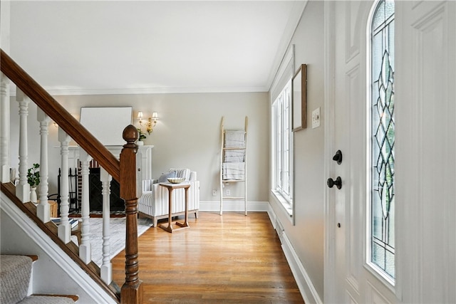 717 Kewanna Ave, Mt Lebanon, PA 15234 - foyer with stairs, wood finished floors, ornamental molding, and radiator heating unit