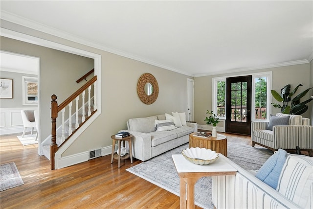 717 Kewanna Ave, Mt Lebanon, PA 15234 - living room featuring ornamental molding, light wood-type flooring, and stairway