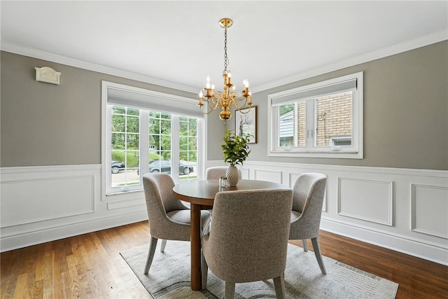 717 Kewanna Ave, Mt Lebanon, PA 15234 - dining room with ornamental molding, a chandelier, healthy amount of natural light, wainscoting, and dark wood-type flooring