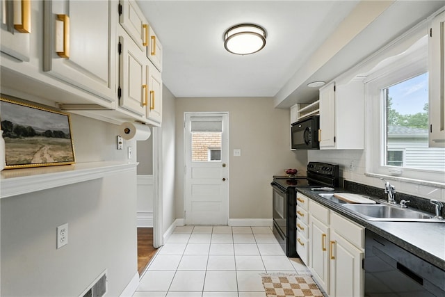717 Kewanna Ave, Mt Lebanon, PA 15234 - kitchen featuring black appliances, white cabinetry, dark countertops, and light tile patterned flooring