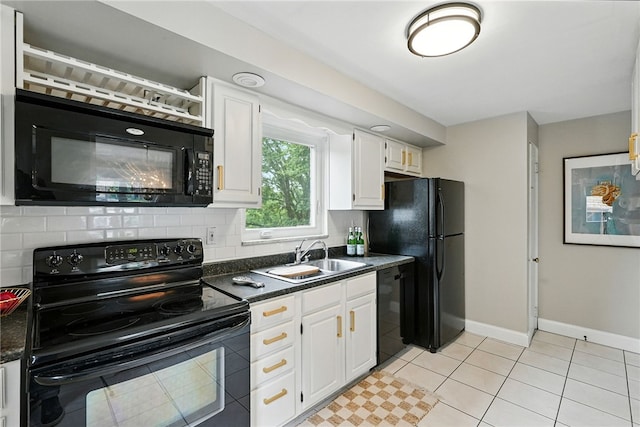 717 Kewanna Ave, Mt Lebanon, PA 15234 - kitchen with black appliances, dark countertops, tasteful backsplash, white cabinetry, and light tile patterned floors