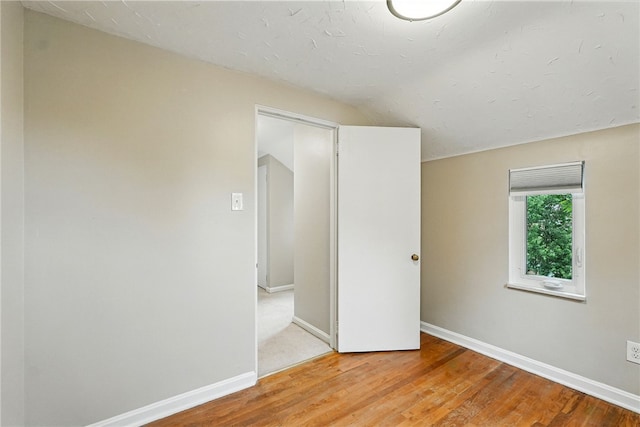 717 Kewanna Ave, Mt Lebanon, PA 15234 - unfurnished bedroom with light wood-style floors and vaulted ceiling