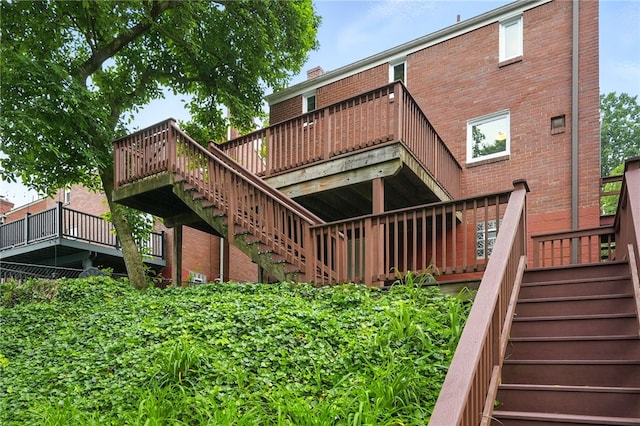 717 Kewanna Ave, Mt Lebanon, PA 15234 - rear view of house with stairway, brick siding, and a wooden deck