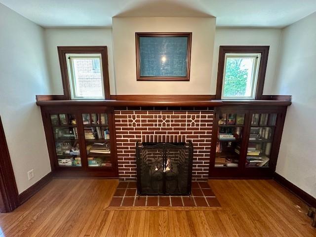 111 Race St, Edgewood, PA 15218 - detailed view of a tiled fireplace and wood finished floors