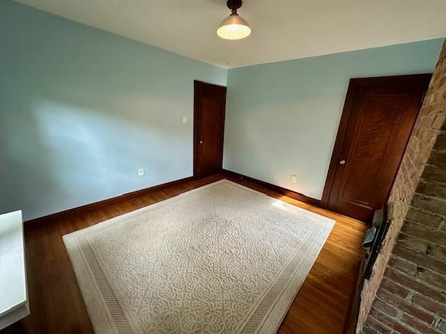 111 Race St, Regent Square, PA 15218 - unfurnished bedroom featuring wood finished floors and baseboards