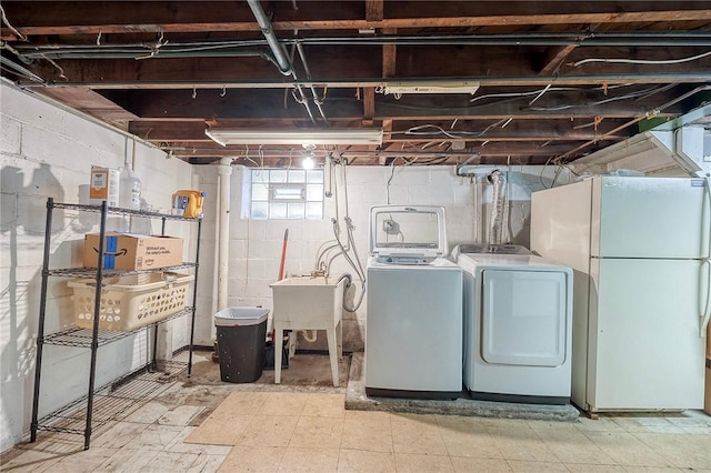 725 Dunster St, Brookline, PA 15226 - basement with freestanding refrigerator, separate washer and dryer, and tile patterned floors