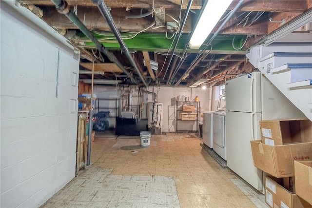 725 Dunster St, Brookline, PA 15226 - unfinished basement featuring washer and clothes dryer, freestanding refrigerator, water heater, tile patterned floors, and stairway
