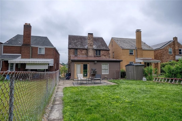 725 Dunster St, Brookline, PA 15226 - back of property featuring a shed, a patio area, and a chimney