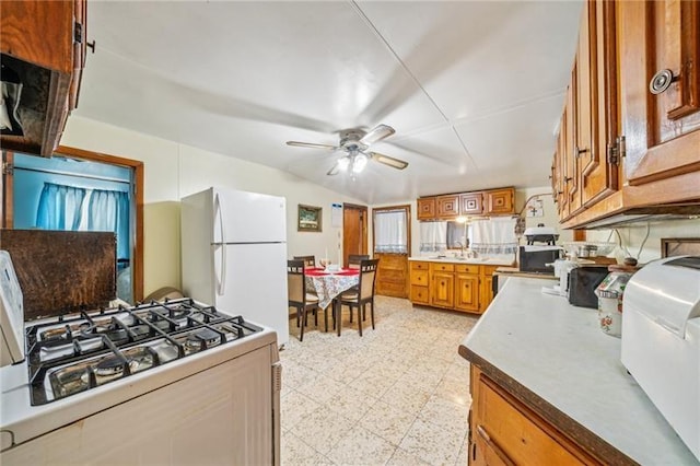 1920 Renton Rd, Plum Boro, PA 15239 - kitchen featuring brown cabinetry, a ceiling fan, and white appliances