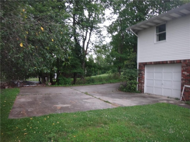 110 Raymond Ave, Luzerne Twp, PA 15417 - view of yard featuring a garage and driveway