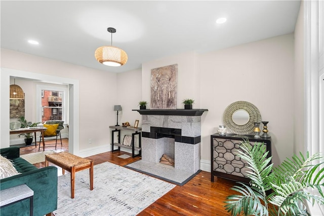 927 Greenfield Ave, Greenfield, PA 15217 - living room with wood finished floors, recessed lighting, and a multi sided fireplace