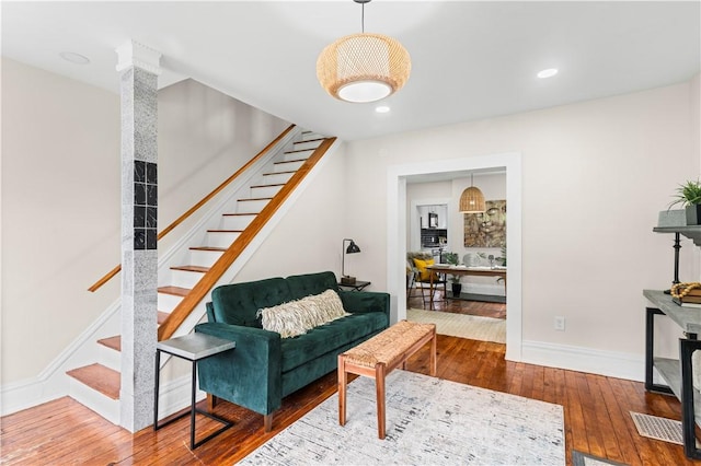 927 Greenfield Ave, Greenfield, PA 15217 - living room featuring hardwood / wood-style flooring, stairway, and recessed lighting