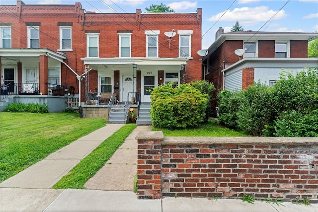 927 Greenfield Ave, Greenfield, PA 15217 - multi unit property with a porch, brick siding, and a front yard