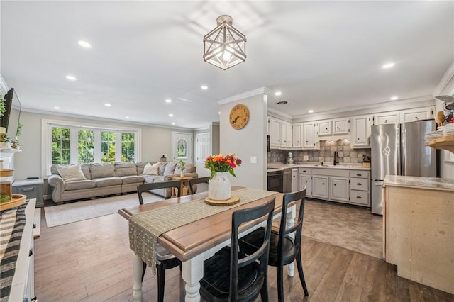 425 Sandy Dr, Shaler, PA 15116 - dining area with crown molding, dark wood finished floors, and recessed lighting