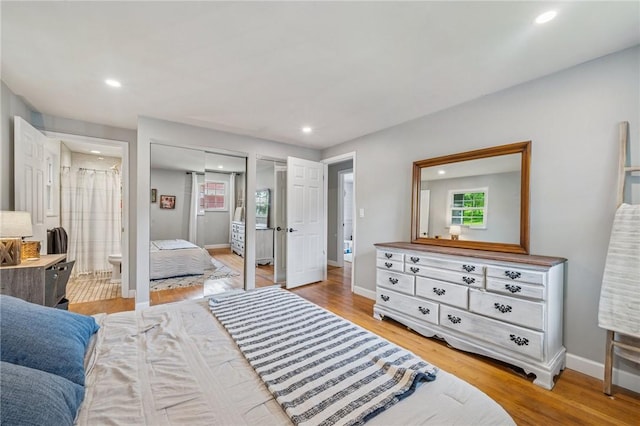 425 Sandy Dr, Shaler, PA 15116 - bedroom with recessed lighting, two closets, wood finished floors, and ensuite bathroom