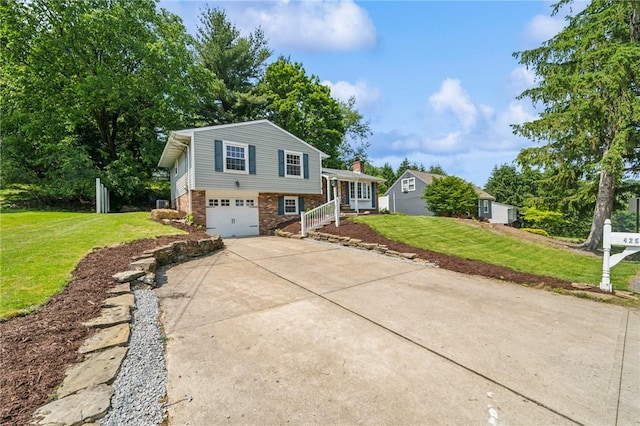425 Sandy Dr, Shaler, PA 15116 - tri-level home featuring driveway, brick siding, an attached garage, and a front lawn