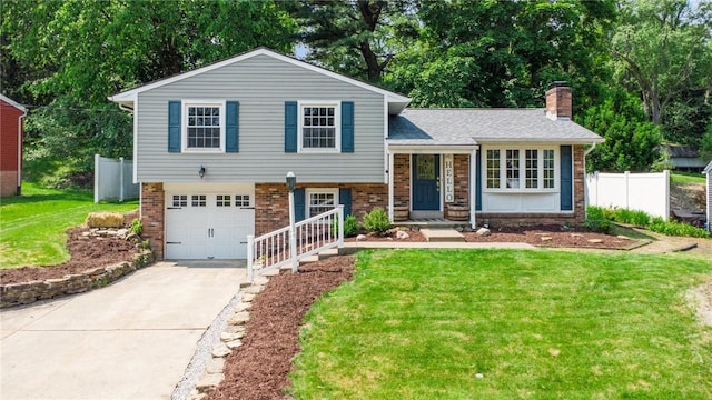 425 Sandy Dr, Shaler, PA 15116 - tri-level home featuring brick siding, concrete driveway, a garage, and a chimney