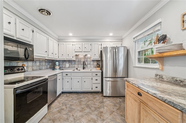 425 Sandy Dr, Shaler, PA 15116 - kitchen with appliances with stainless steel finishes, ornamental molding, white cabinets, light countertops, and tasteful backsplash