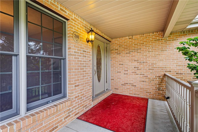 246 Johnston Rd, Bentleyville, PA 15314 - doorway to property with covered porch and brick siding