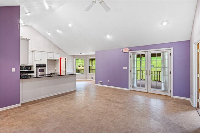 246 Johnston Rd, Bentleyville, PA 15314 - unfurnished living room featuring a ceiling fan, french doors, high vaulted ceiling, and recessed lighting