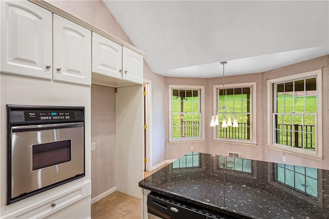 246 Johnston Rd, Bentleyville, PA 15314 - kitchen with stainless steel oven, dark stone countertops, white cabinets, vaulted ceiling, and decorative light fixtures