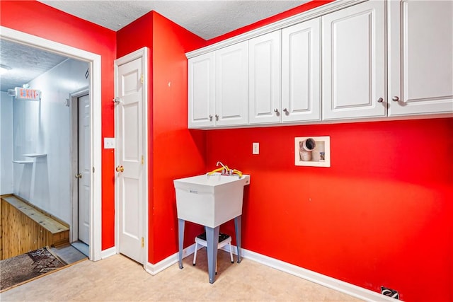 246 Johnston Rd, Bentleyville, PA 15314 - laundry area featuring cabinet space, hookup for a washing machine, and a textured ceiling