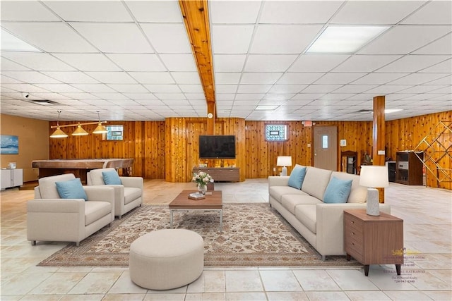 246 Johnston Rd, Bentleyville, PA 15314 - tiled living room featuring wooden walls and a paneled ceiling