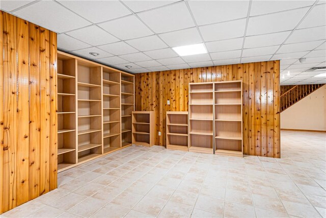 246 Johnston Rd, Bentleyville, PA 15314 - empty room with wood walls, tile patterned flooring, and a paneled ceiling