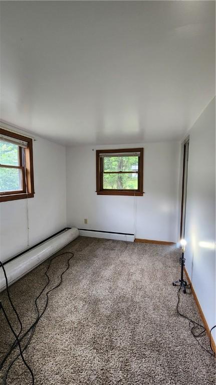 1008 Wallace St, Vandergrift Wml, PA 15690 - carpeted spare room featuring plenty of natural light and baseboard heating