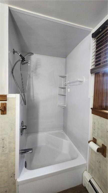 1008 Wallace St, Vandergrift Wml, PA 15690 - bathroom with a baseboard heating unit and tub / shower combination
